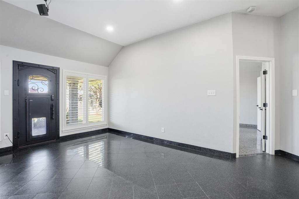 12701 Beech Tree Lane Fort Worth, TX 76040 - Photo 28 of 33 an empty room with large window and wooden floor