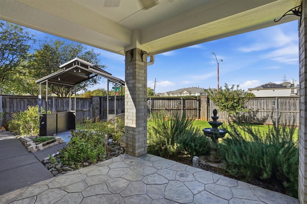 12701 Beech Tree Lane Fort Worth, TX 76040 - Photo 3 of 33 a view of a garden with a chair