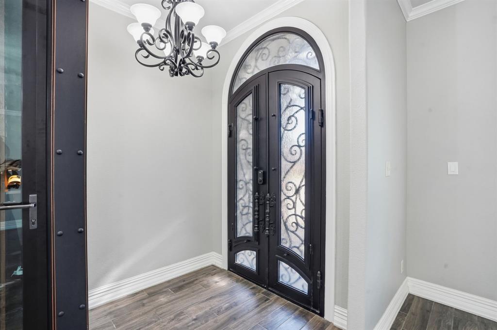 12701 Beech Tree Lane Fort Worth, TX 76040 - Photo 5 of 33 a view of an entryway with wooden floor