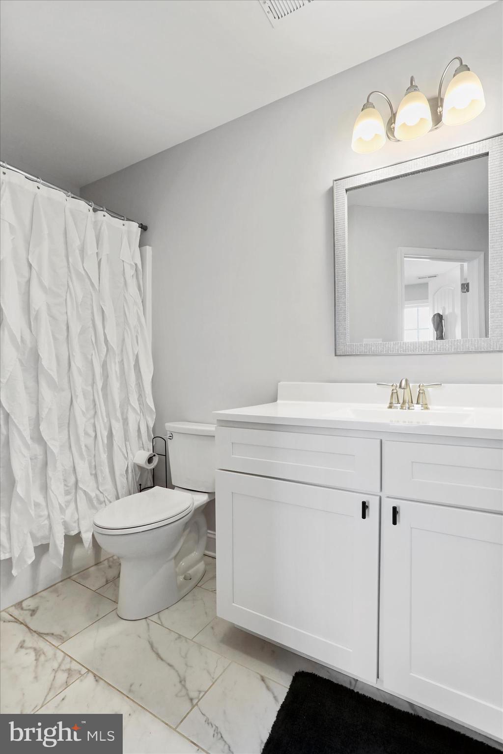 219 Summerfield Way Shenandoah Junction, WV 25442 - Photo 25 of 36 a bathroom with a sink toilet and mirror