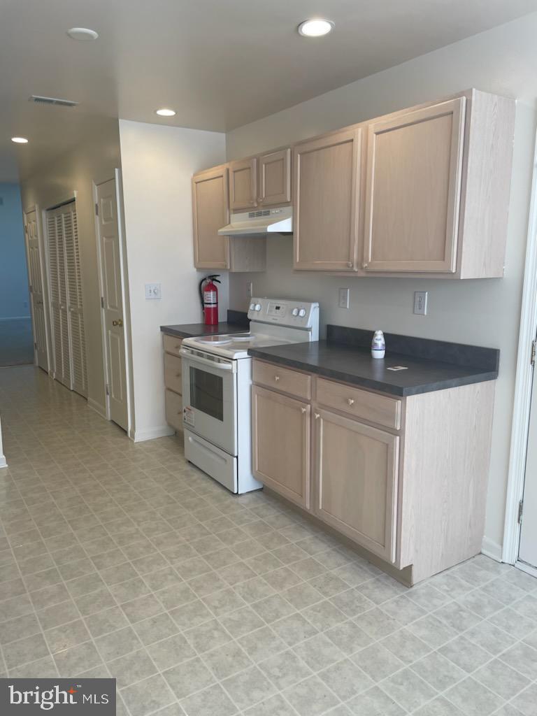 28 Palmer Square Beverly, NJ 08010 - Photo 10 of 12 a kitchen with white cabinets