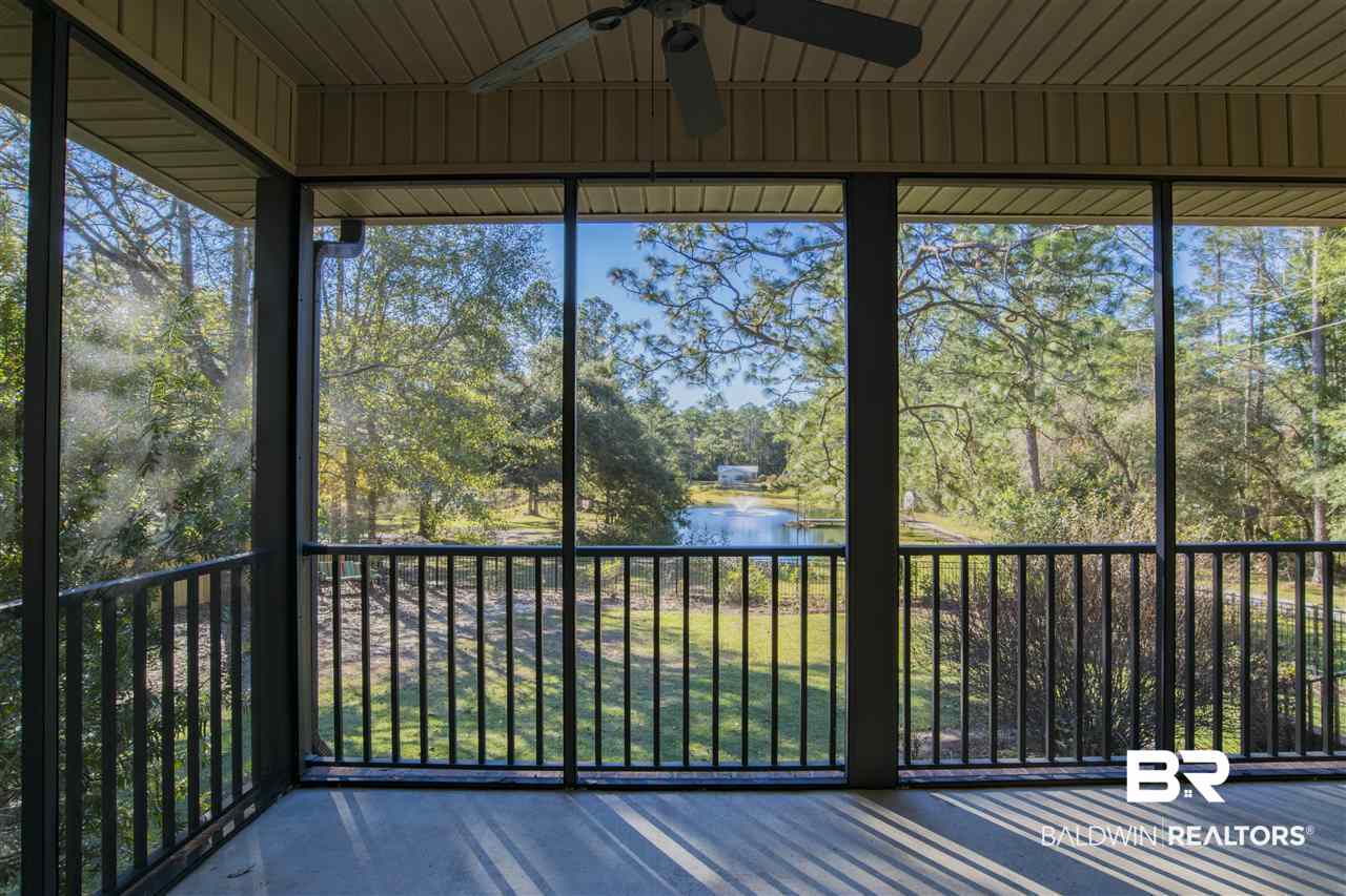 11064 Rosa Court Fairhope, AL 36532 - Photo 31 of 50 Large screened in back porch overlooks pond