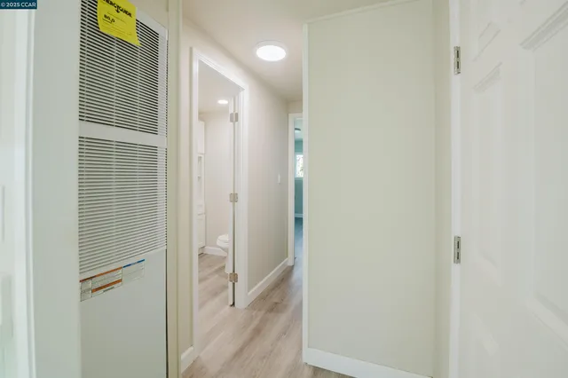 a bathroom with a shower and a glass door