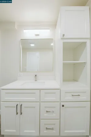 a kitchen with a sink and cabinets