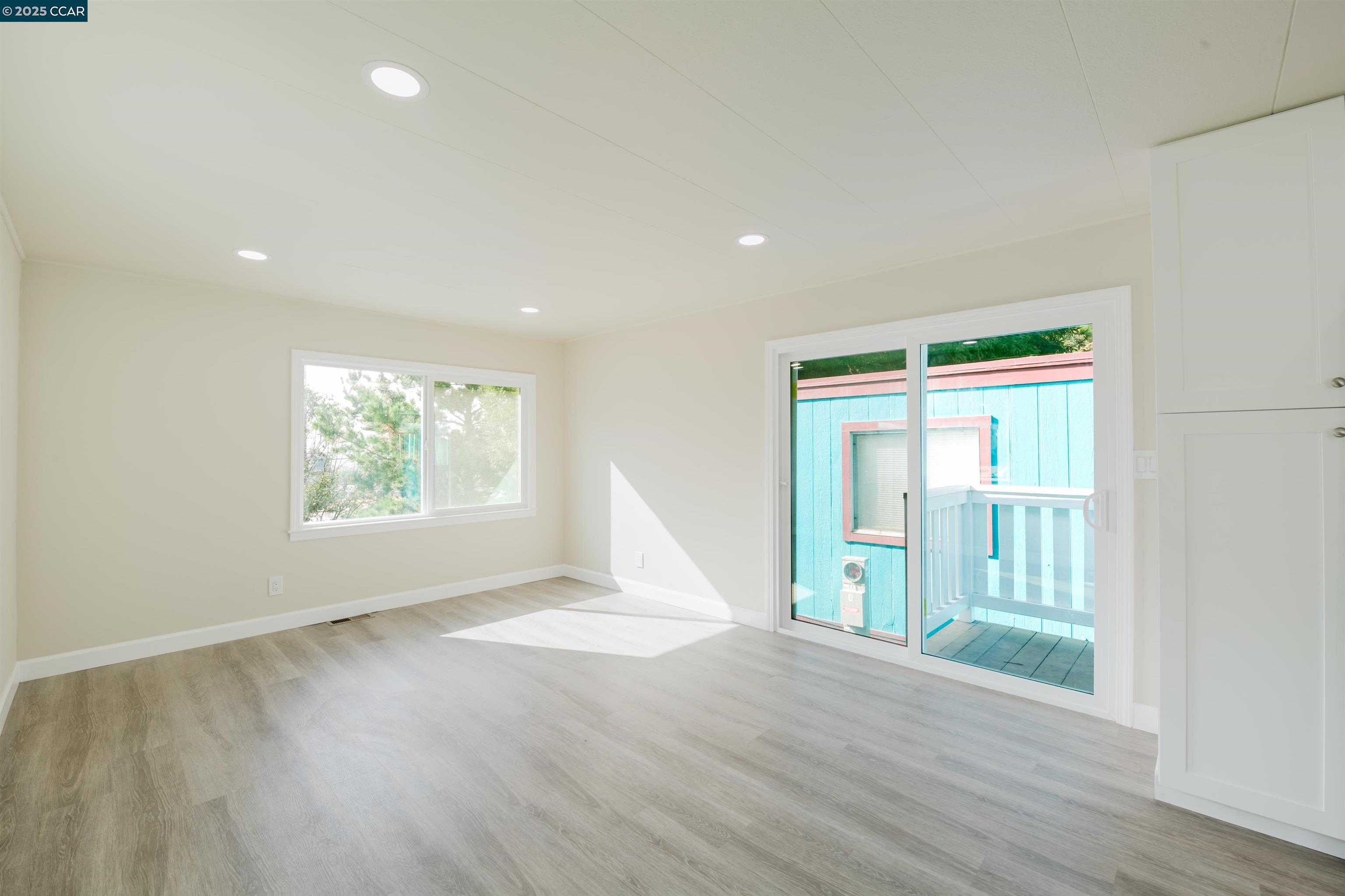 2990 San Pablo Dam Road, Unit 2 San Pablo, CA 94803 - Photo 39 of 41 an empty room with wooden floor and windows