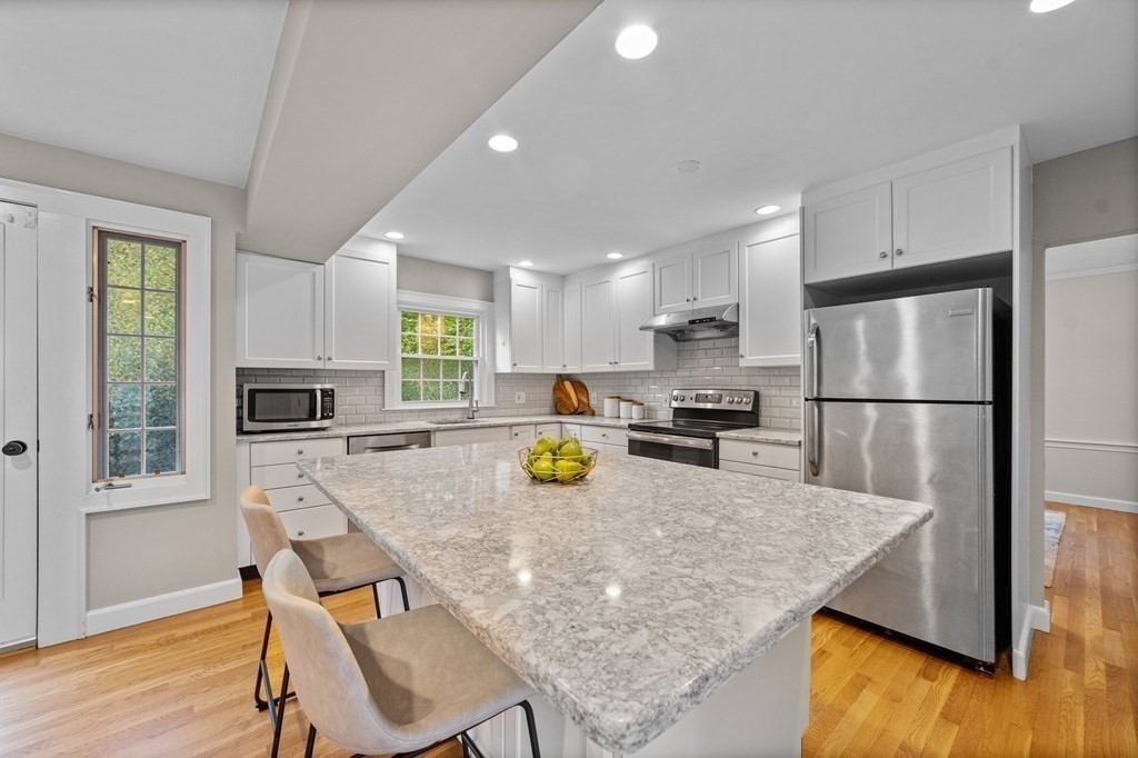 8 Parker Road Needham, MA 02494 - Photo 1 of 28 a kitchen with refrigerator and cabinets