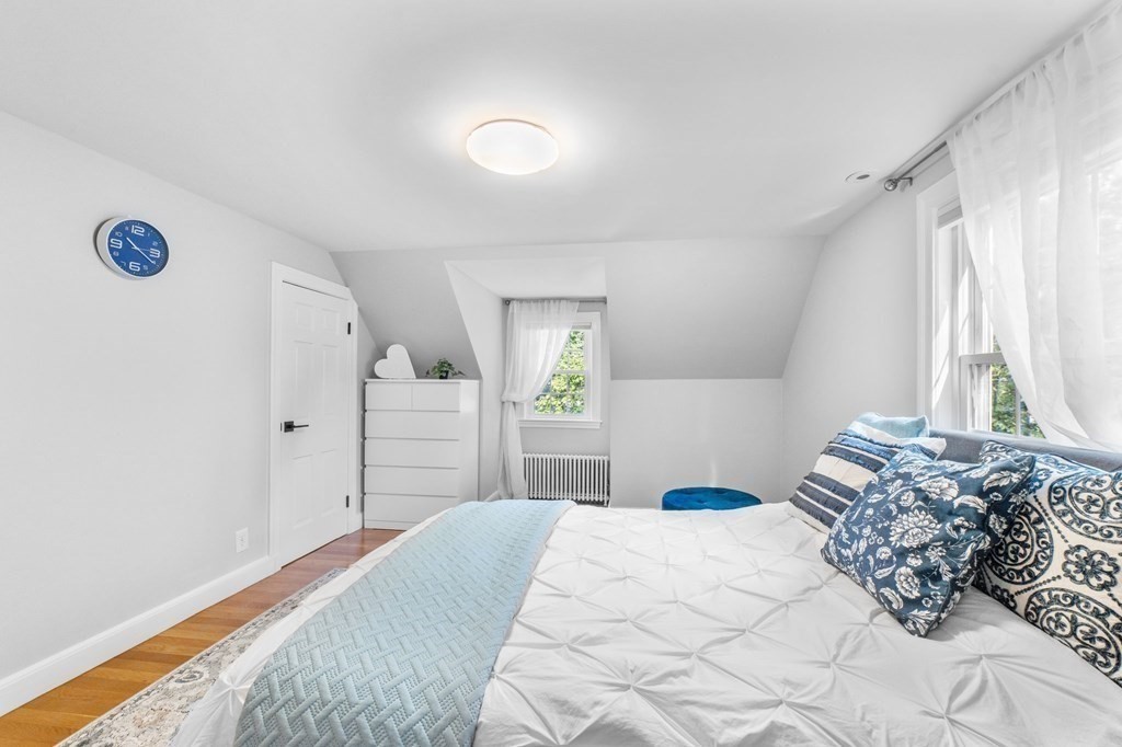 8 Parker Road Needham, MA 02494 - Photo 17 of 28 a bedroom with a bed and a window
