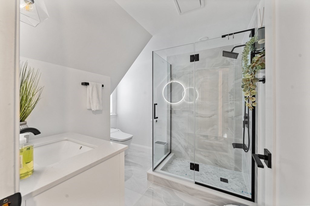 8 Parker Road Needham, MA 02494 - Photo 21 of 28 a bathroom with a bathtub and a shower
