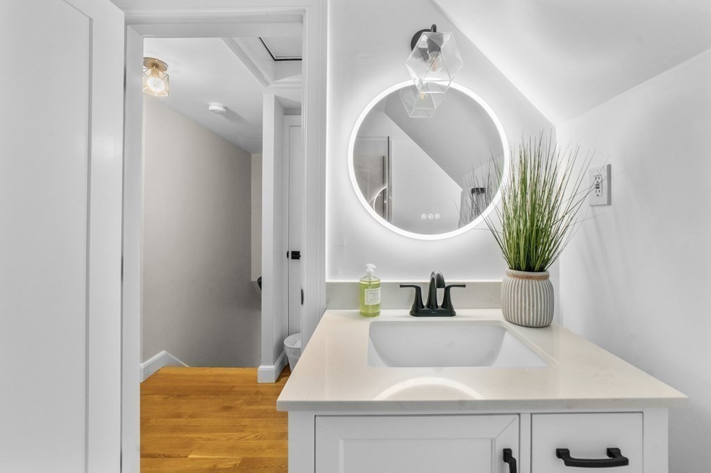 8 Parker Road Needham, MA 02494 - Photo 22 of 28 a bathroom with a sink and a mirror