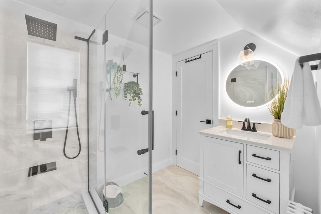 8 Parker Road Needham, MA 02494 - Photo 23 of 28 a bathroom with a double vanity sink mirror and shower