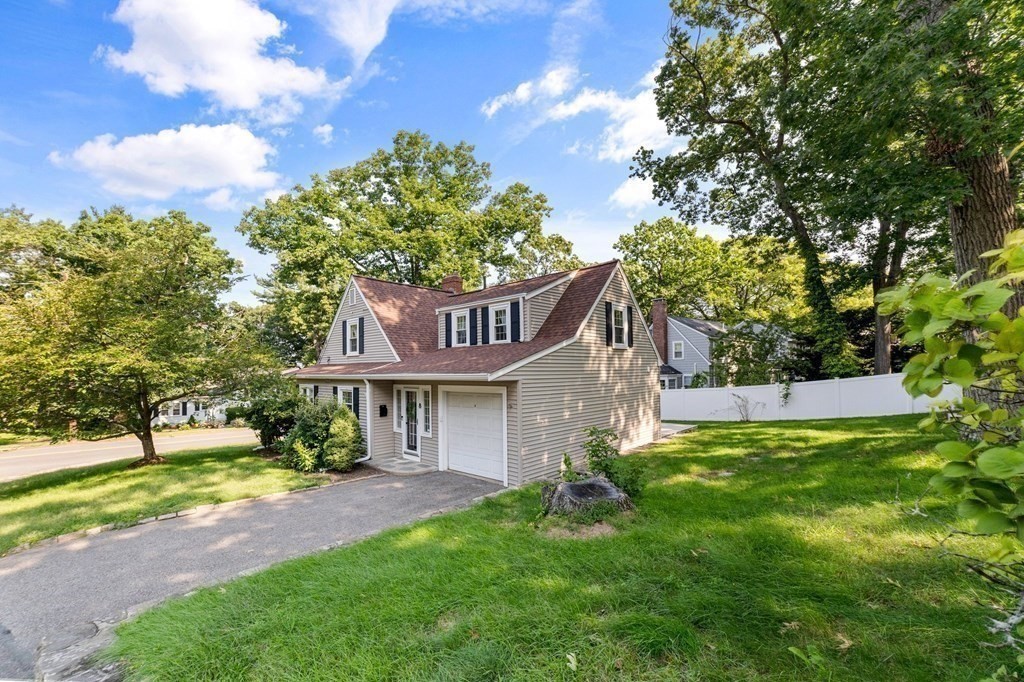 8 Parker Road Needham, MA 02494 - Photo 3 of 28 a front view of a house with a yard