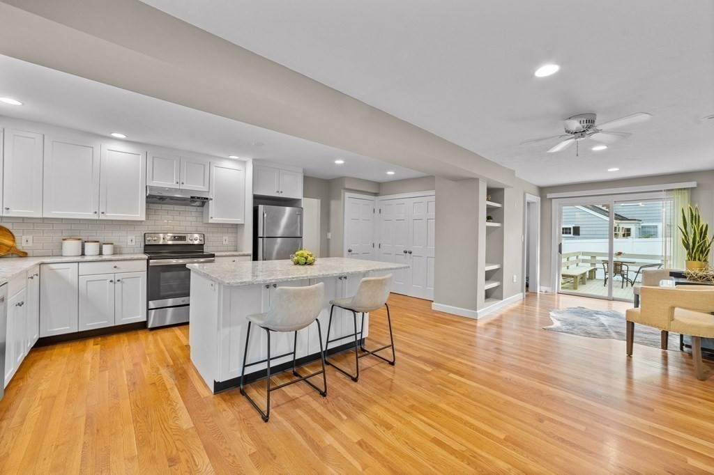 8 Parker Road Needham, MA 02494 - Photo 5 of 28 a kitchen with a sink and wooden floor