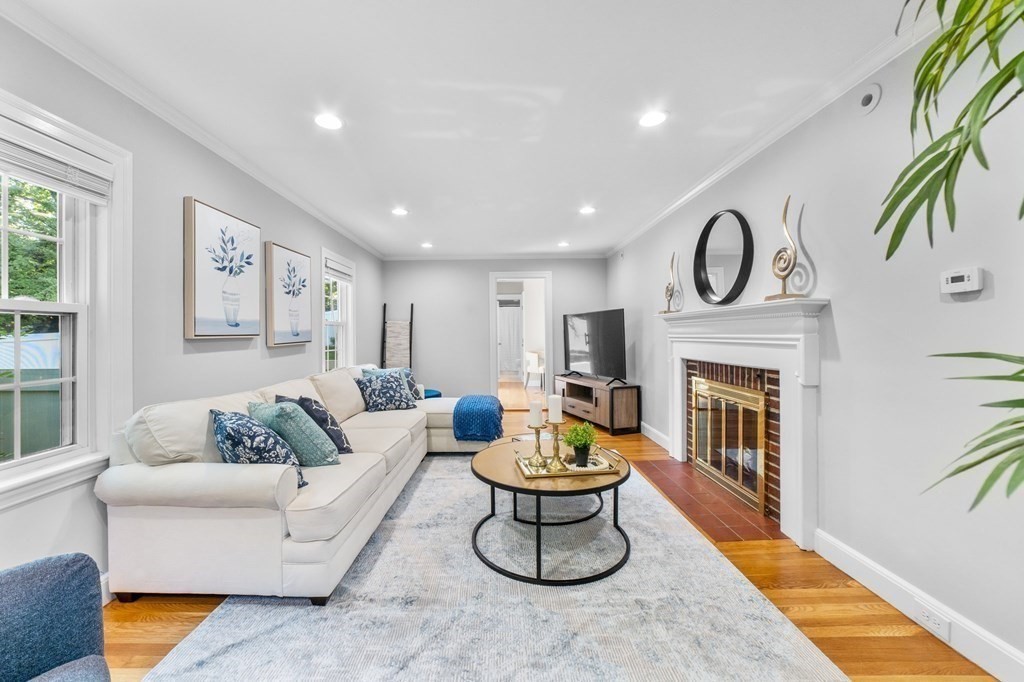 8 Parker Road Needham, MA 02494 - Photo 10 of 28 a living room with furniture and a fireplace