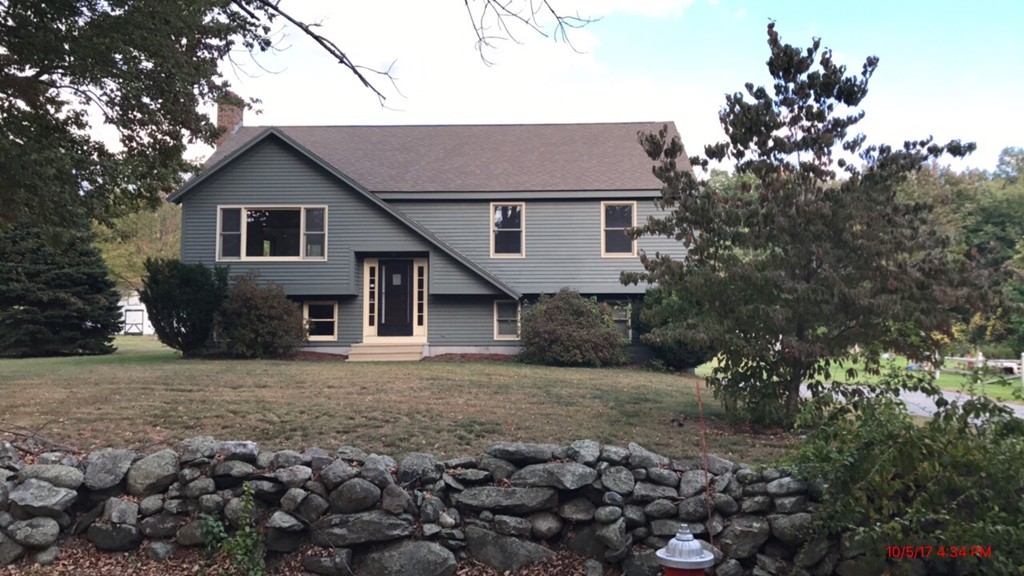102 Adams Road Grafton, MA 01536 - Photo 1 of 23 a house that has a tree in front of the house