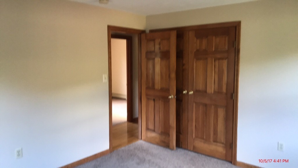 102 Adams Road Grafton, MA 01536 - Photo 19 of 23 a view of a hallway with closet area