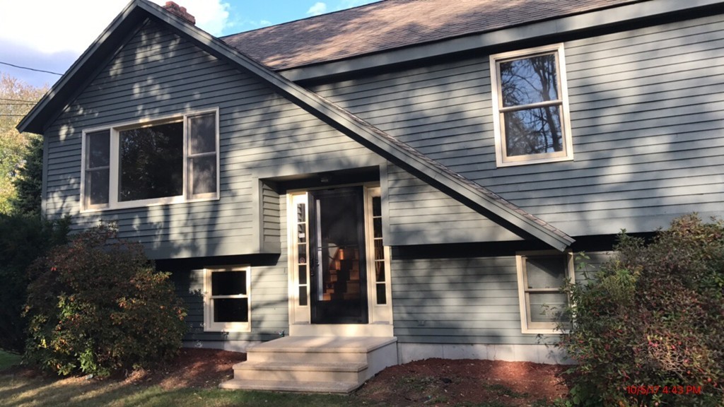 102 Adams Road Grafton, MA 01536 - Photo 4 of 23 a front view of a house with garden