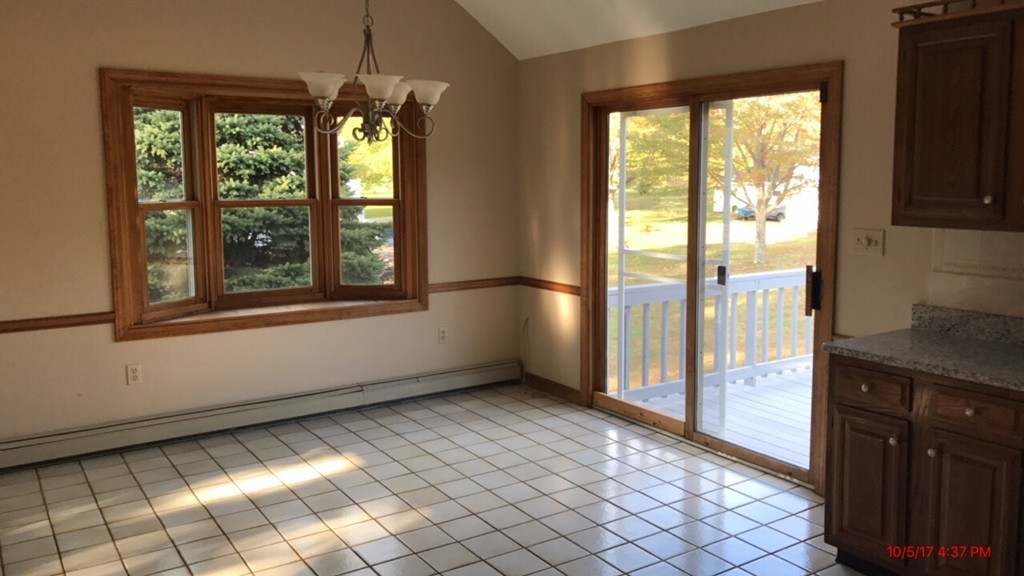 102 Adams Road Grafton, MA 01536 - Photo 8 of 23 a view of an empty room with a large window