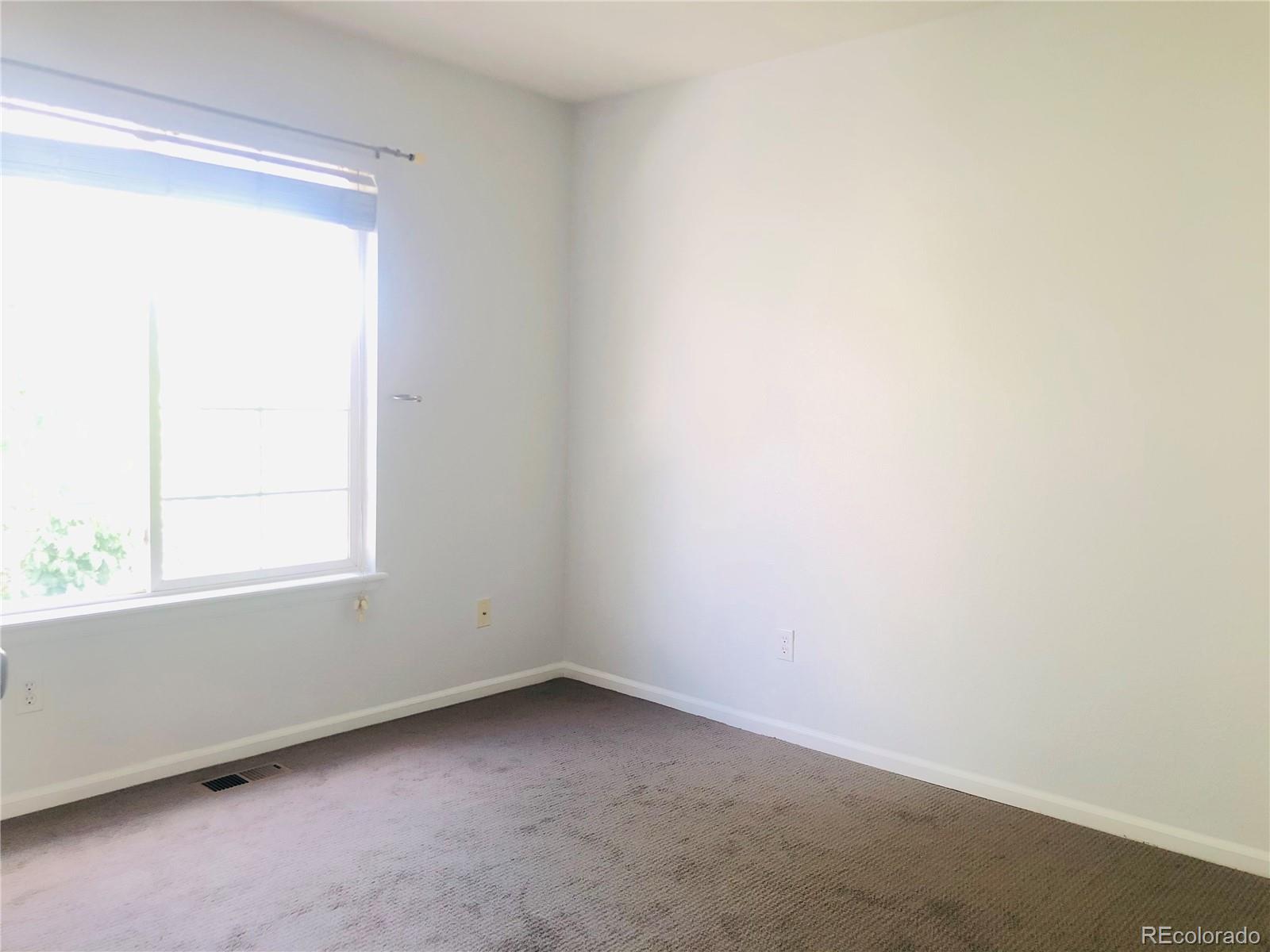 11788 Zenobia Loop Westminster, CO 80031 - Photo 11 of 18 an empty room with a window