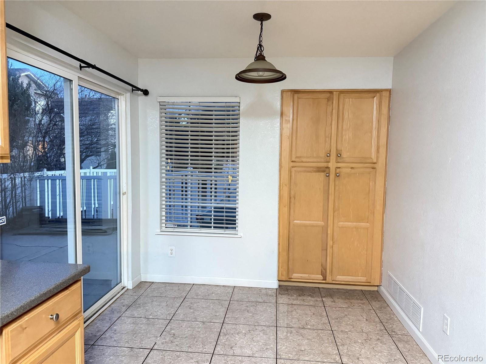 11788 Zenobia Loop Westminster, CO 80031 - Photo 6 of 18 a view of an empty room with a window