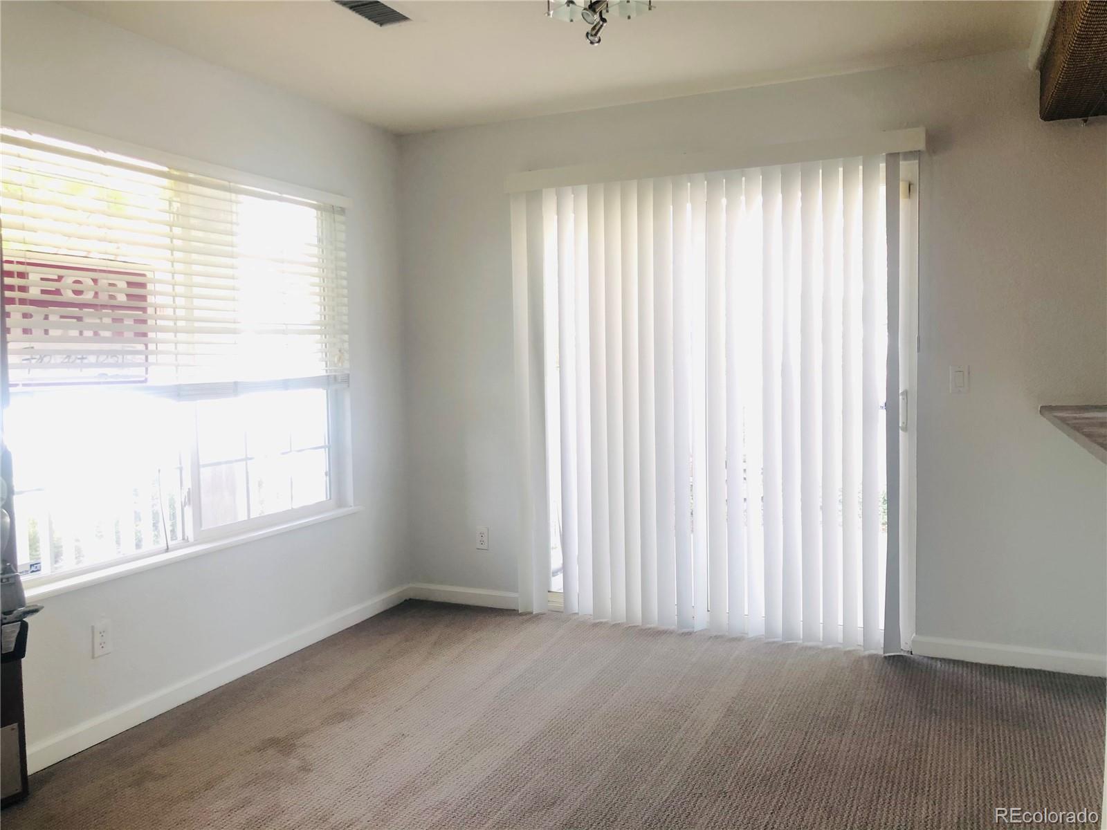 11788 Zenobia Loop Westminster, CO 80031 - Photo 7 of 18 an empty room with windows