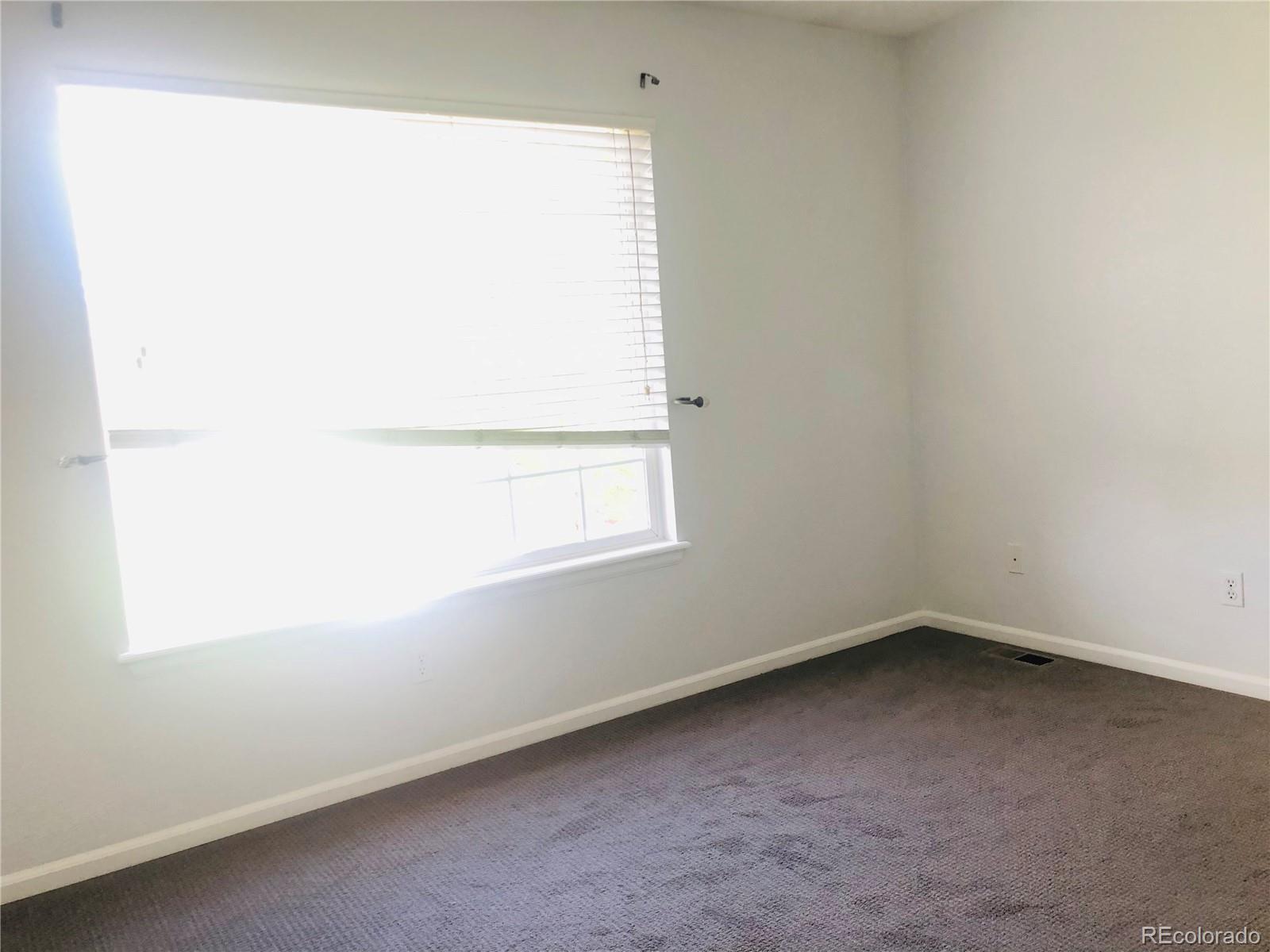 11788 Zenobia Loop Westminster, CO 80031 - Photo 8 of 18 an empty room with a window