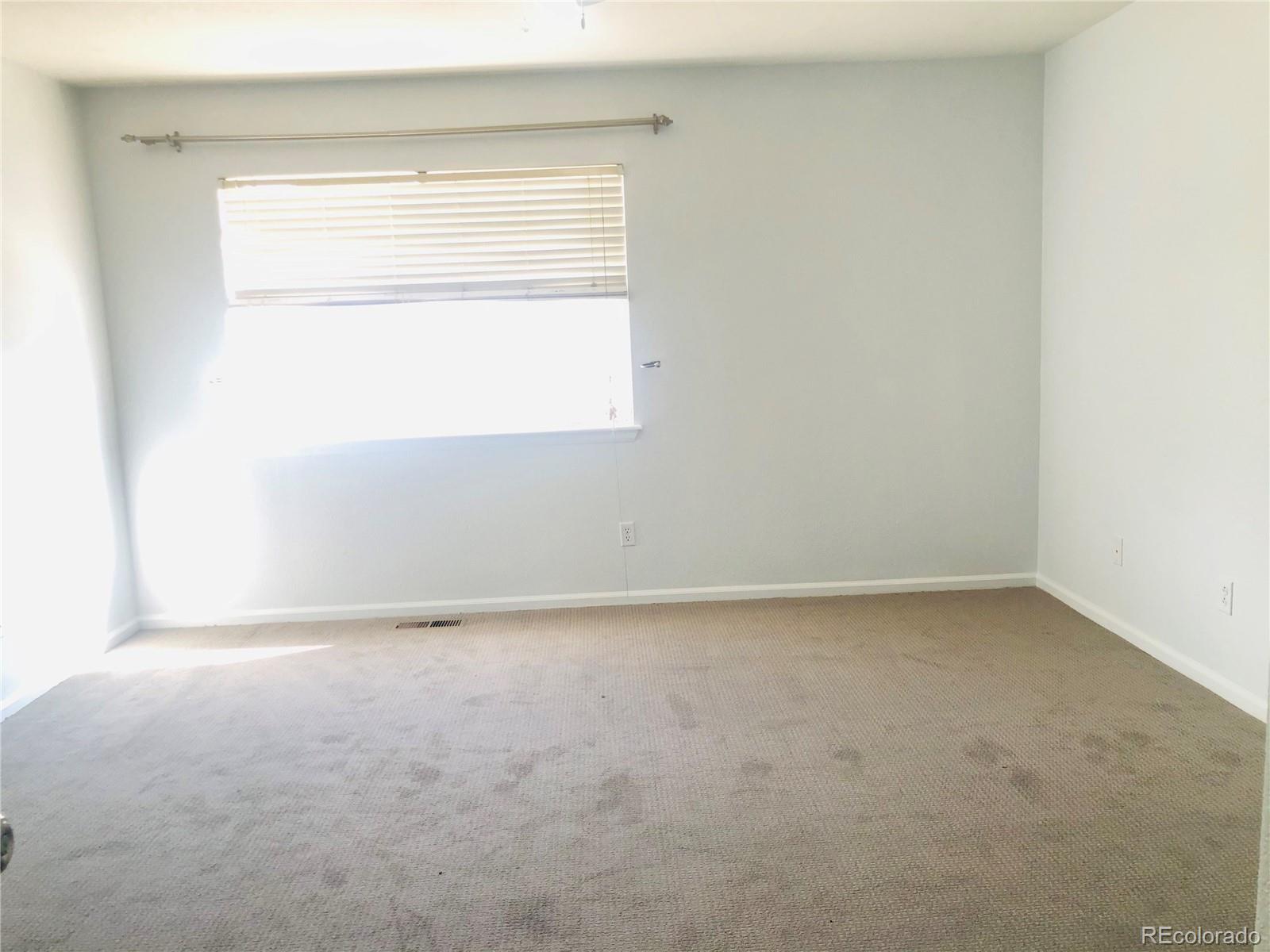 11788 Zenobia Loop Westminster, CO 80031 - Photo 10 of 18 a view of an empty room with a window