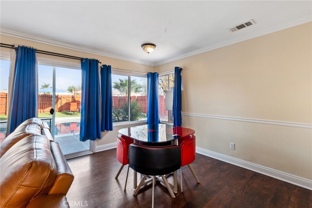 16398 Heather Glen Road Moreno Valley, CA 92551 - Photo 13 of 74 a living room with furniture and a potted plant