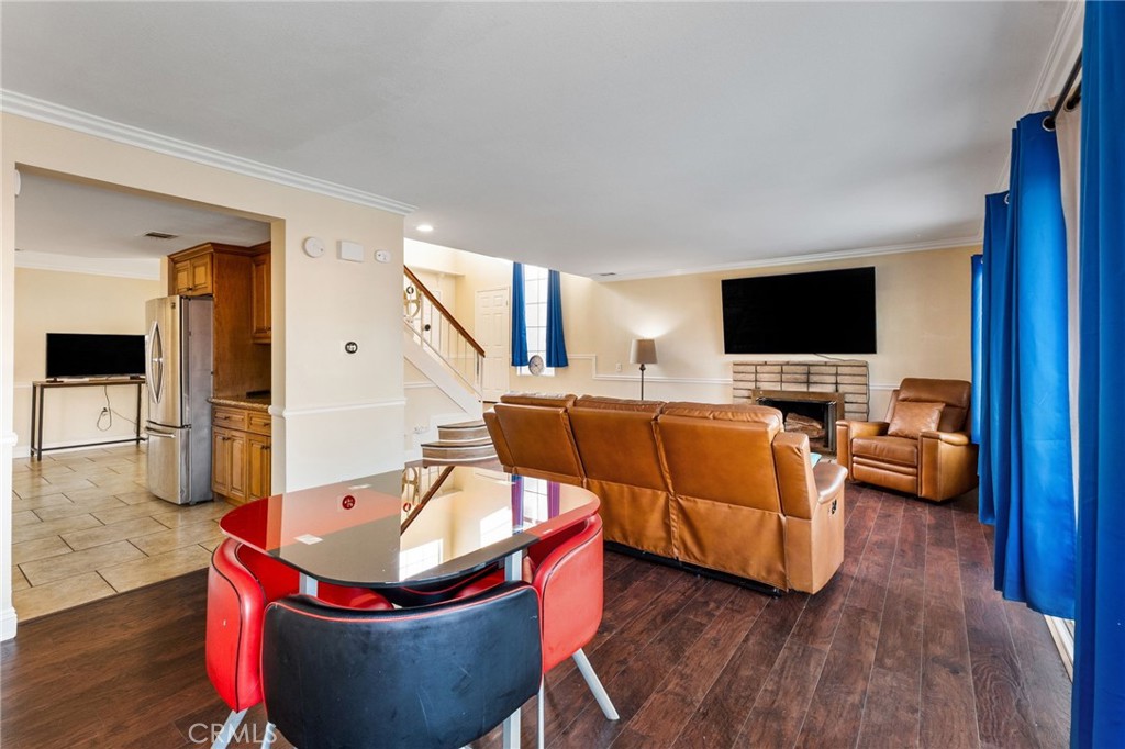 16398 Heather Glen Road Moreno Valley, CA 92551 - Photo 14 of 74 a living room with furniture and a flat screen tv