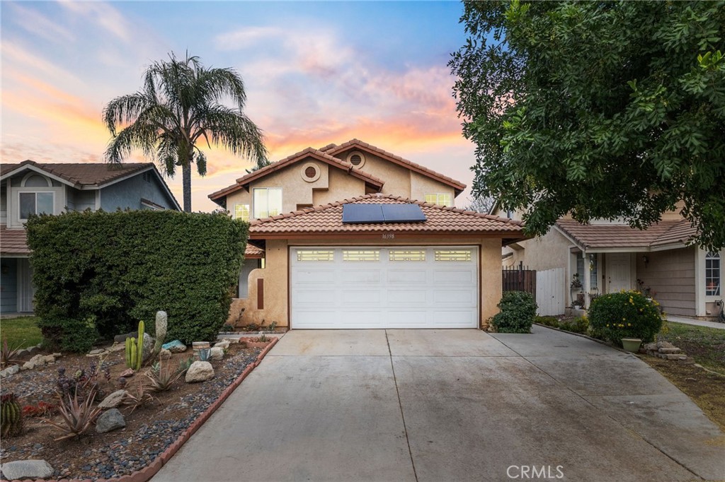 16398 Heather Glen Road Moreno Valley, CA 92551 - Photo 2 of 74 a front view of a house with a yard and garage