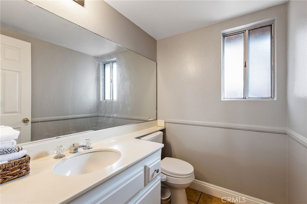 16398 Heather Glen Road Moreno Valley, CA 92551 - Photo 29 of 74 a bathroom with a sink and a mirror