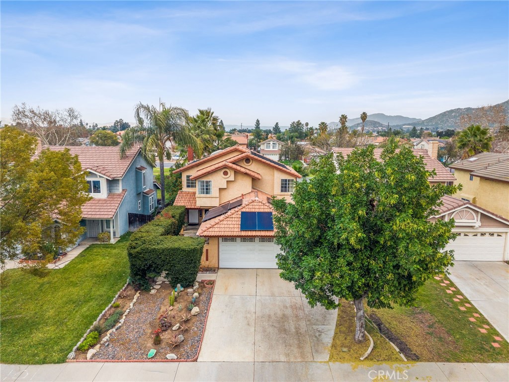 16398 Heather Glen Road Moreno Valley, CA 92551 - Photo 3 of 74 a aerial view of a house with a yard and balcony