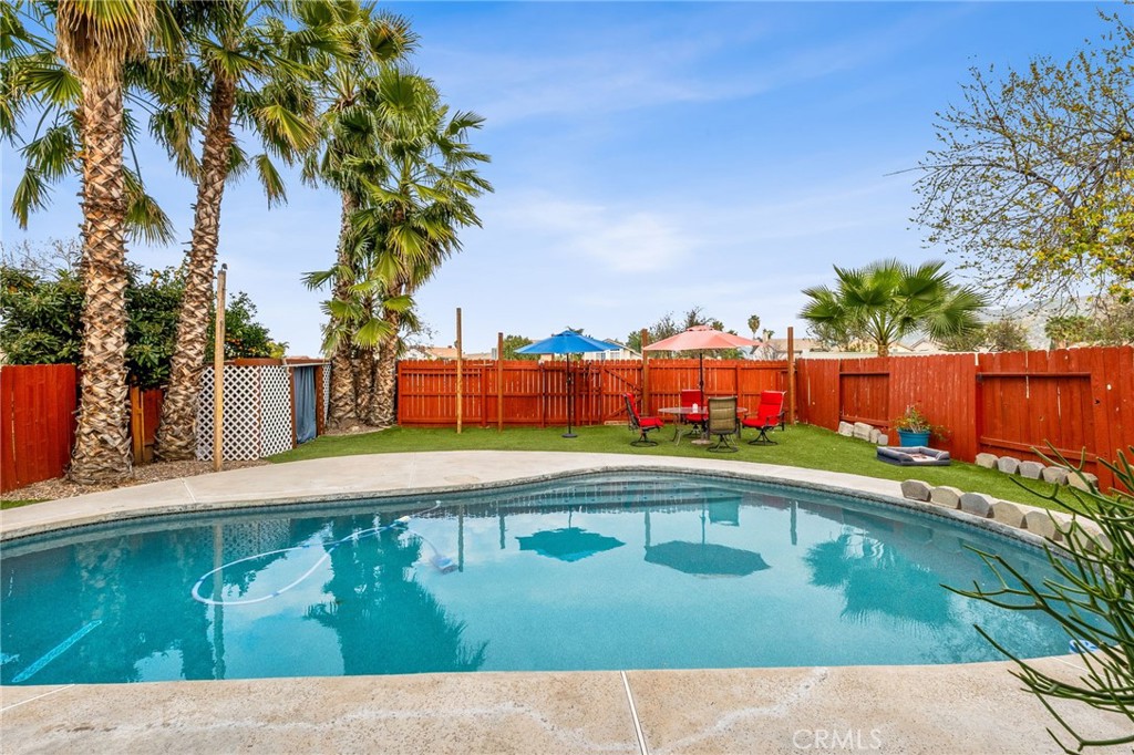 16398 Heather Glen Road Moreno Valley, CA 92551 - Photo 50 of 74 a view of swimming pool with a yard
