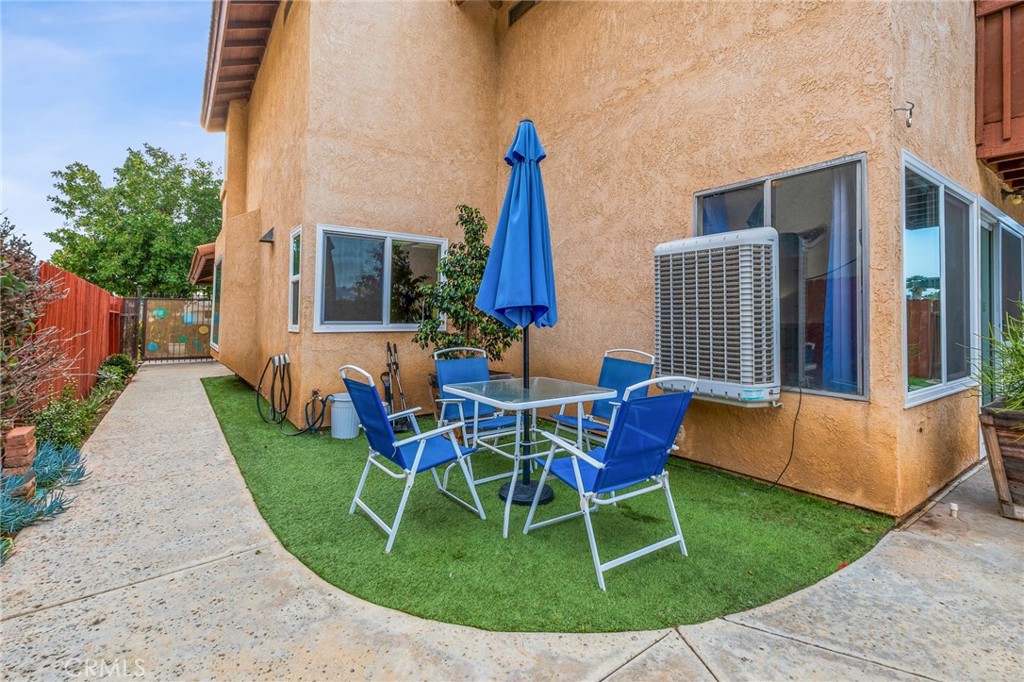 16398 Heather Glen Road Moreno Valley, CA 92551 - Photo 57 of 74 a view of a house with backyard porch and sitting area