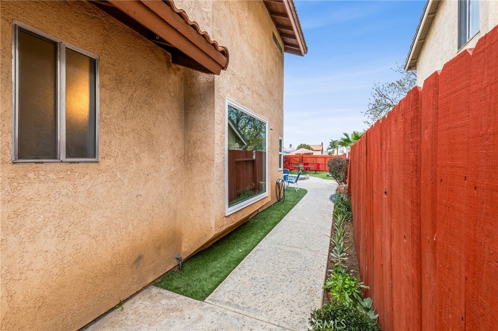16398 Heather Glen Road Moreno Valley, CA 92551 - Photo 58 of 74 a view of a pathway of a house with backyard