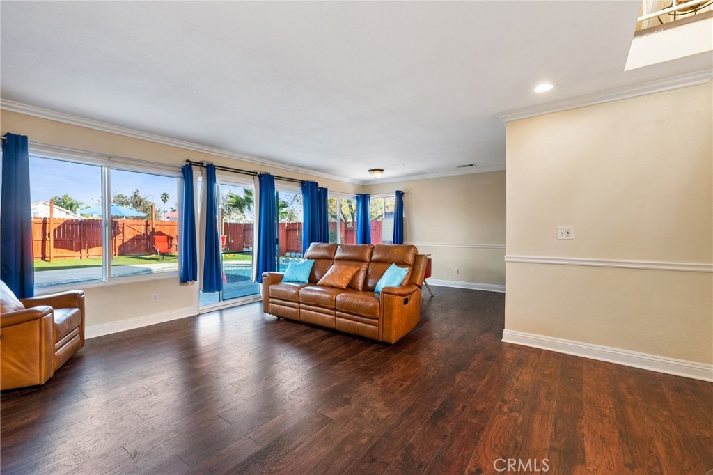 16398 Heather Glen Road Moreno Valley, CA 92551 - Photo 10 of 74 a living room with furniture window and wooden floor