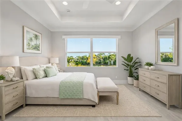 a bedroom with a large bed and a window