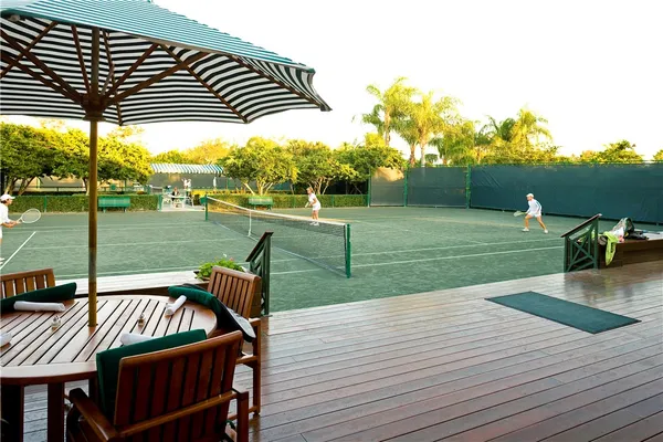 a view of a swimming pool with a patio