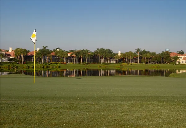 a view of a golf course with a lake