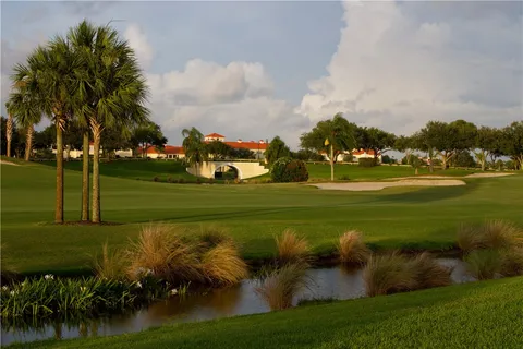 a view of a golf course with a lake