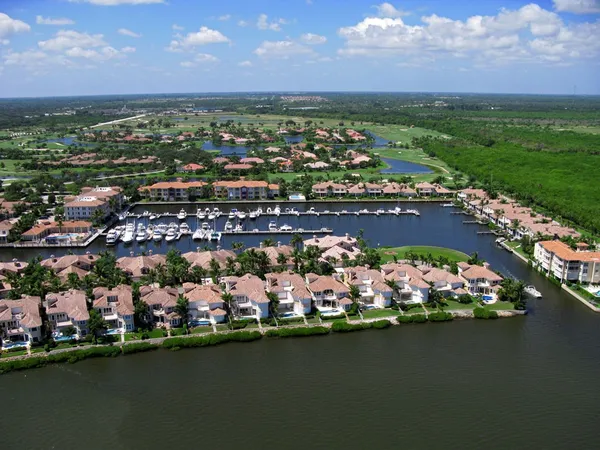an aerial view of a houses with a lake view