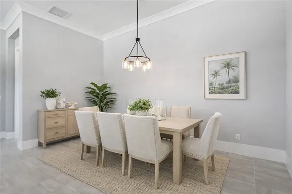 a dining room with furniture and window