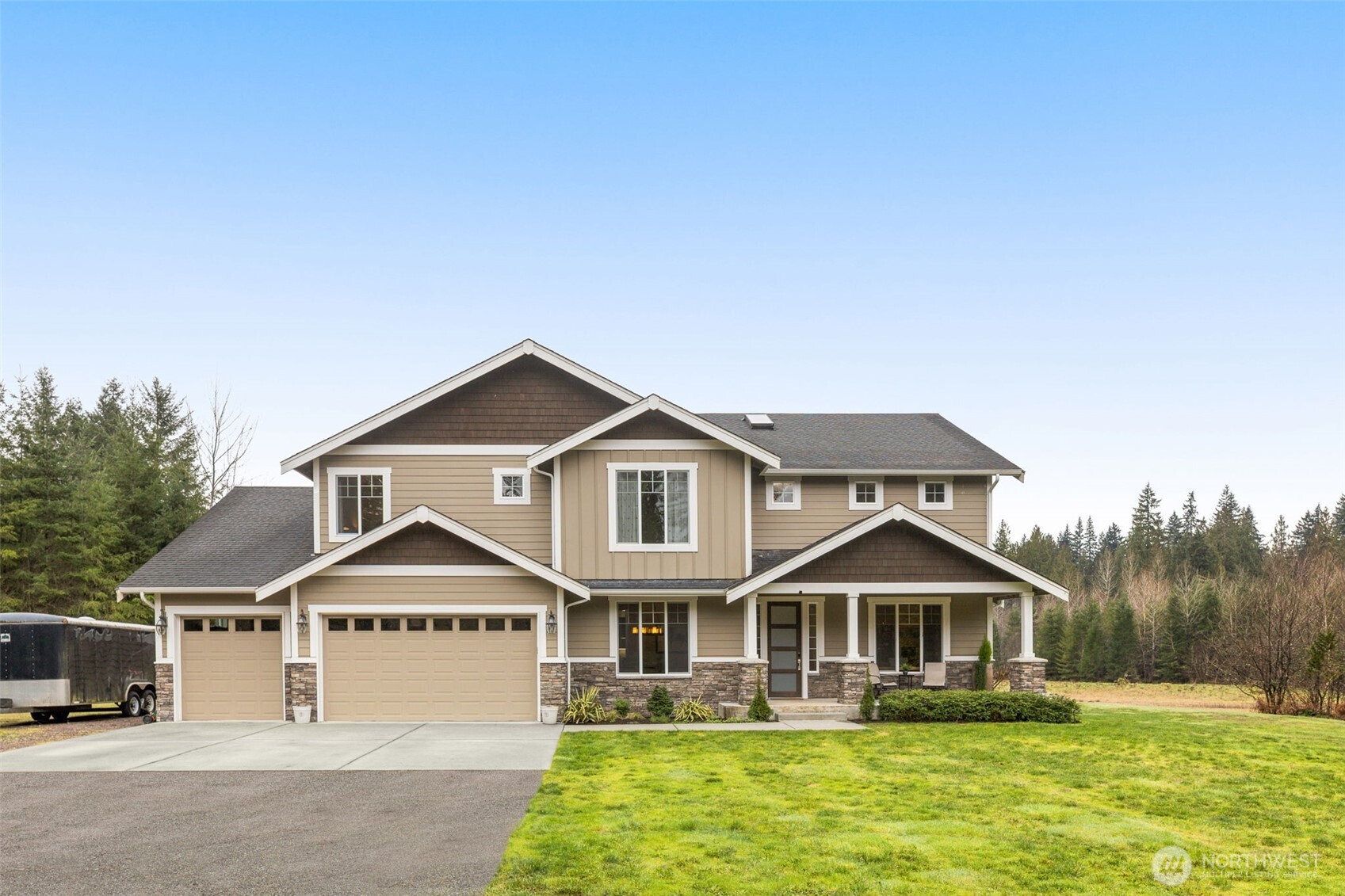 10219 Kelly Road Northeast Carnation, WA 98014 - Photo 2 of 38 a front view of a house with a yard