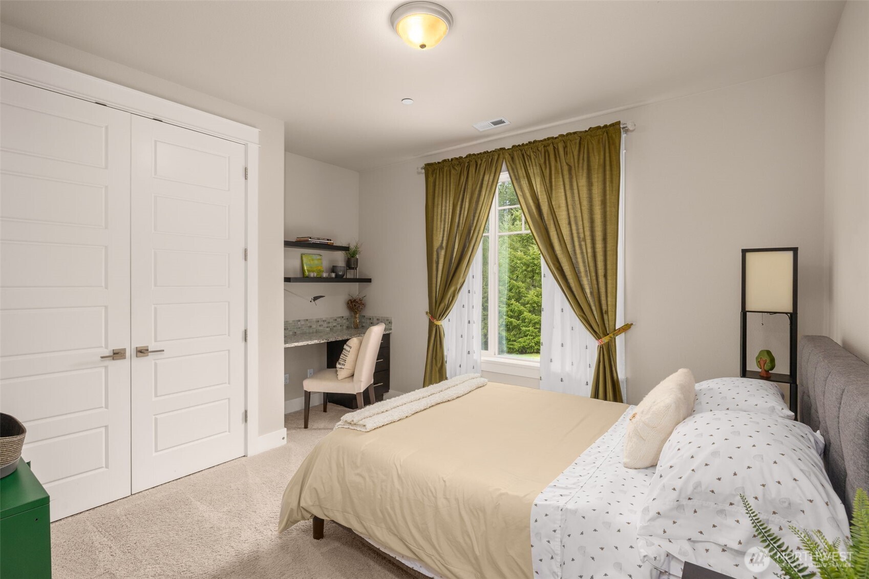 10219 Kelly Road Northeast Carnation, WA 98014 - Photo 25 of 38 a bedroom with a bed and a window