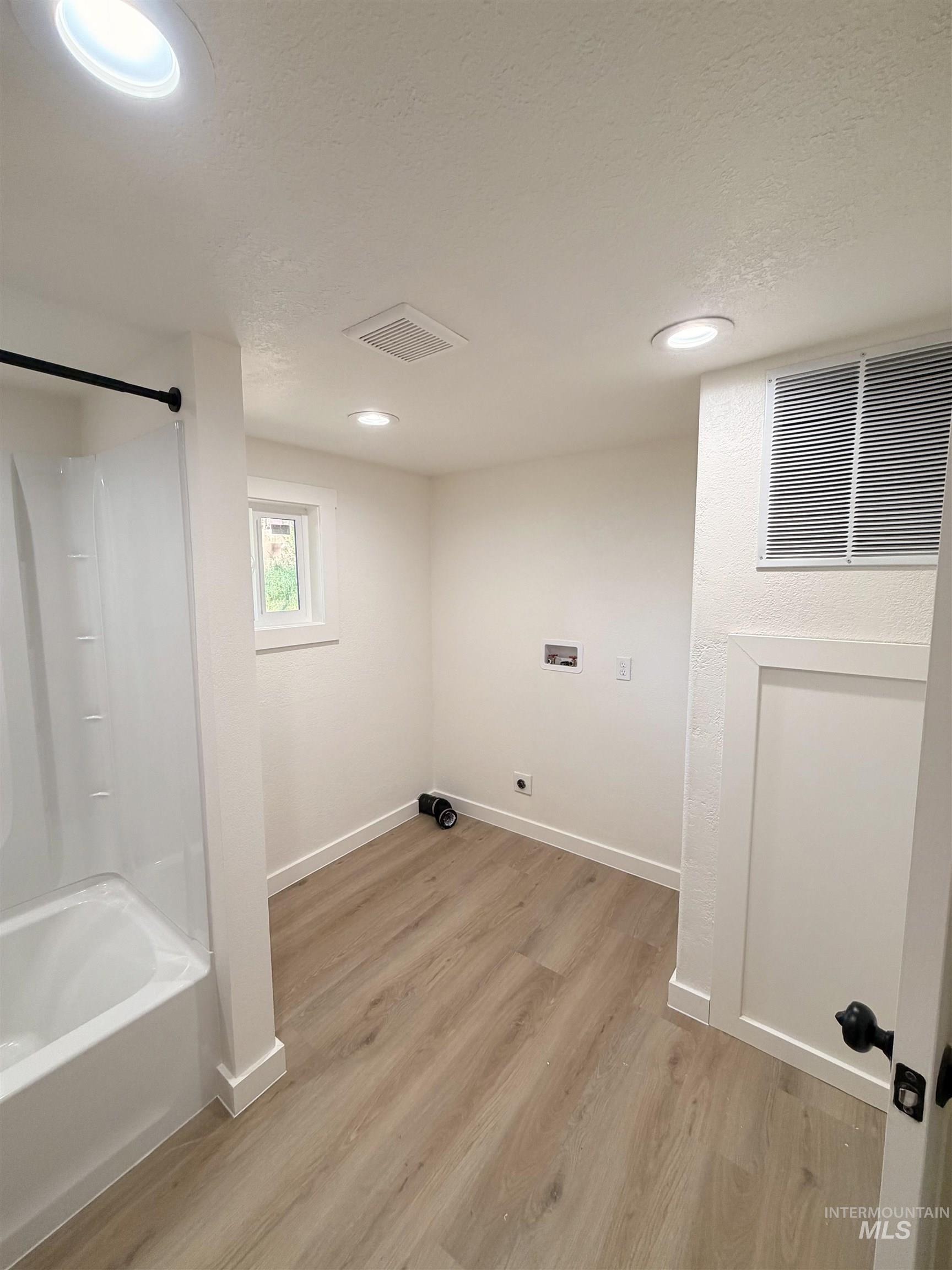 151 View Road Kamiah, ID 83536 - Photo 28 of 49 Light wood-finish flooring complements the crisp white walls and trim