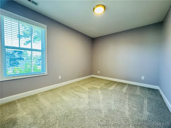 an empty room with a empty space and a window