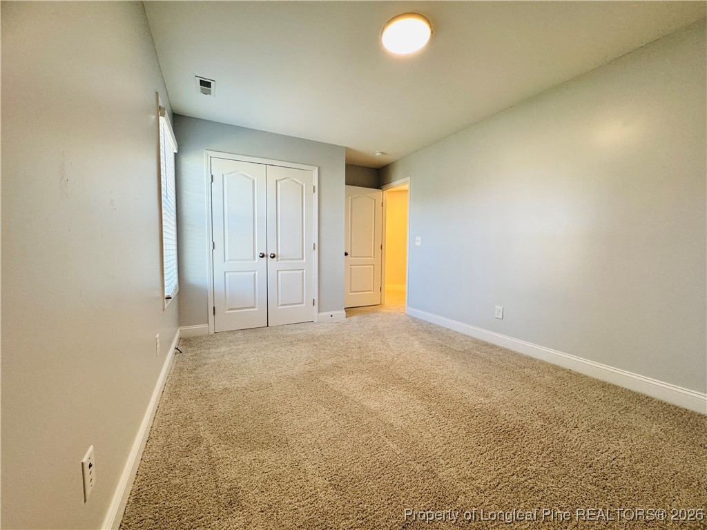 66 Timber Skip Drive Spring Lake, NC 28390 - Photo 21 of 26 an empty room with a natural light