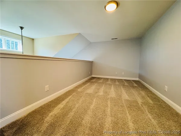 a view of a room with a window and storage
