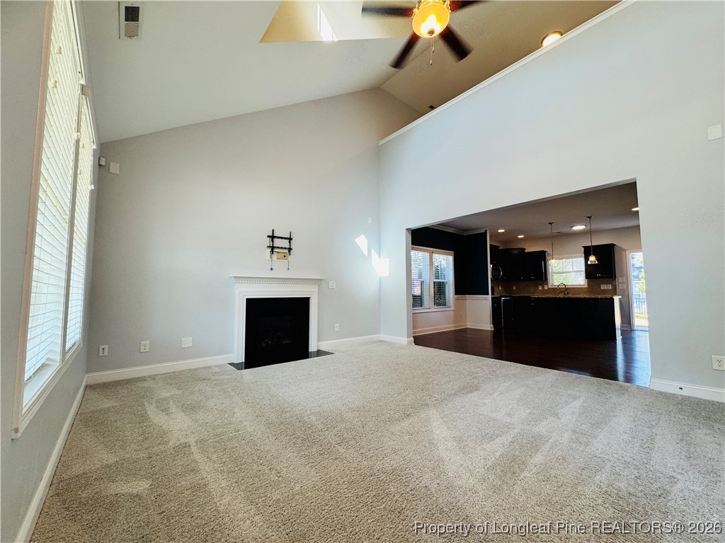 66 Timber Skip Drive Spring Lake, NC 28390 - Photo 3 of 26 a view of an empty room with a fireplace and a window