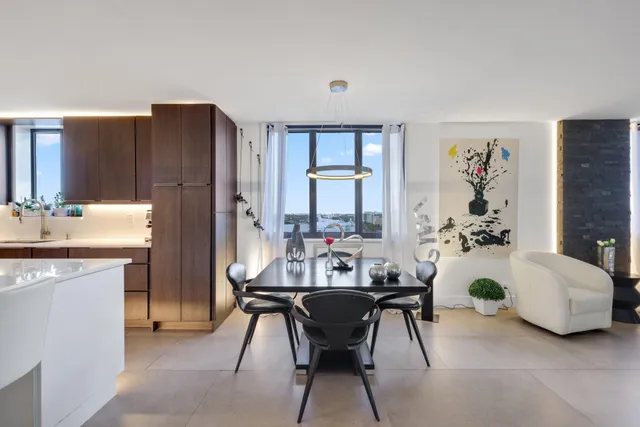 a view of a living room with furniture and a flat screen tv