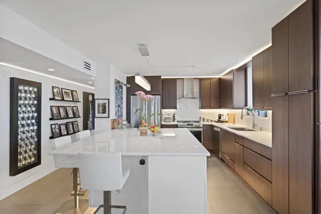a view of a dining room with furniture large windows and wooden floor